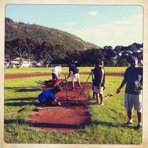 Rep. Choy's team working on the pitcher's mound.